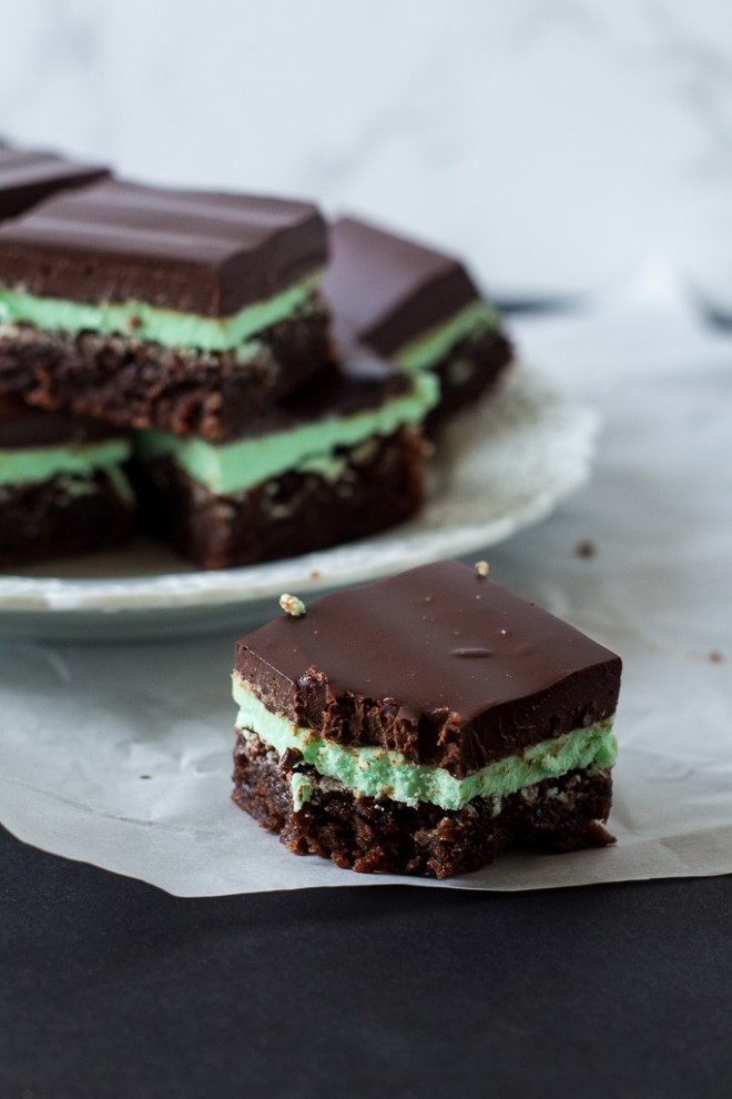 mint brownies on parchment paper and a plate