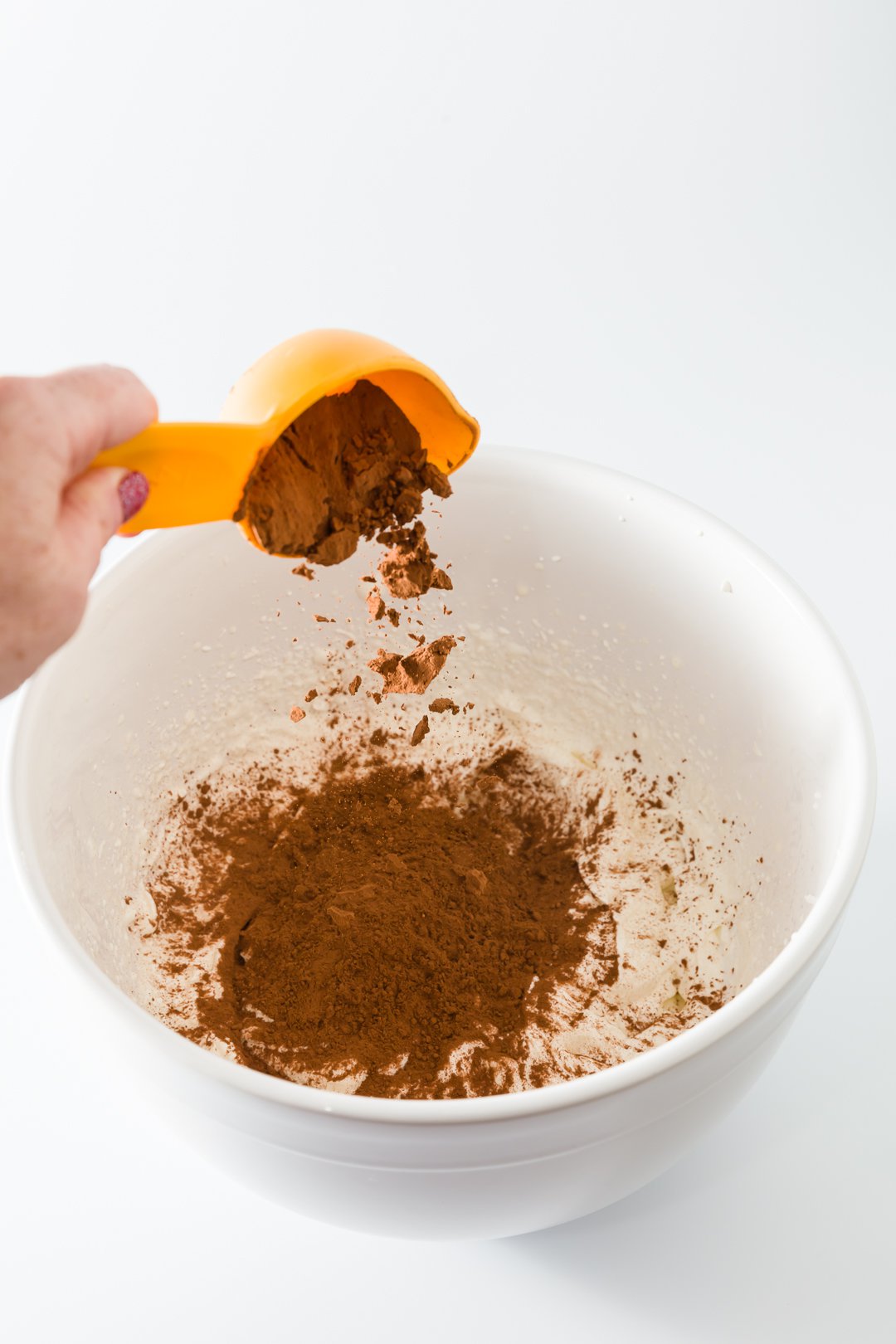 Adding cocoa powder to chocolate whipped cream