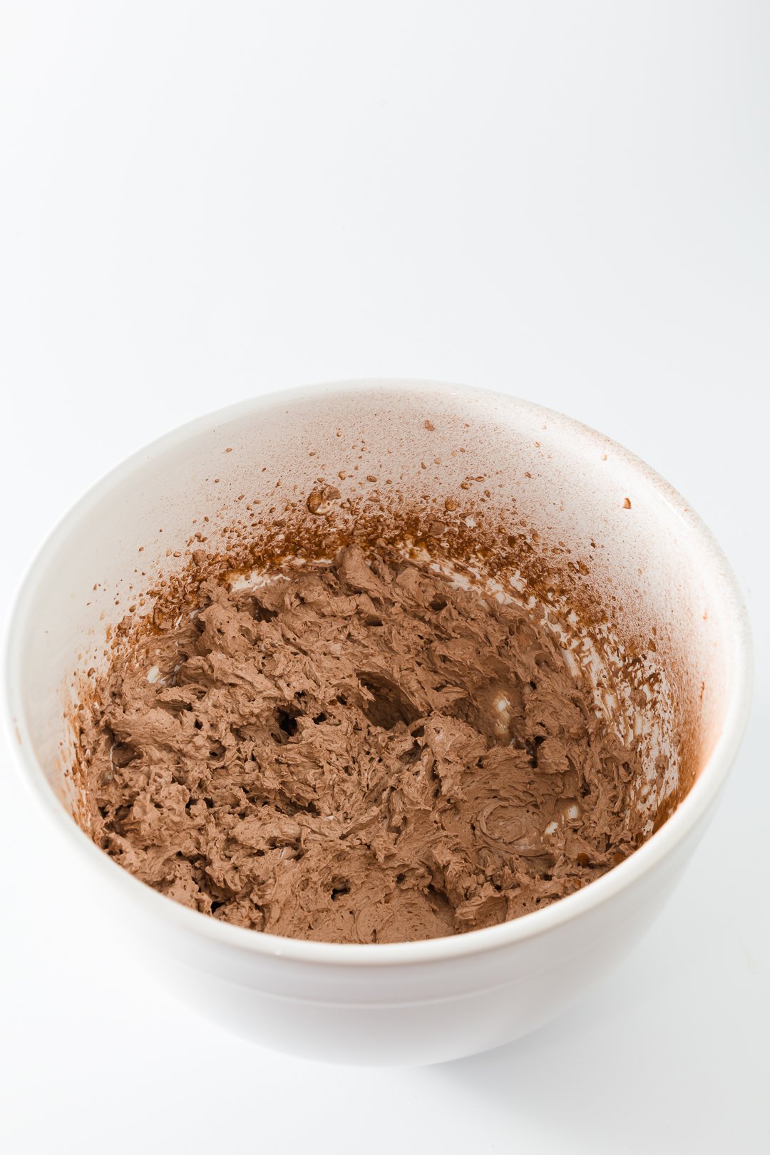 Chocolate whipped cream in a mixing bowl