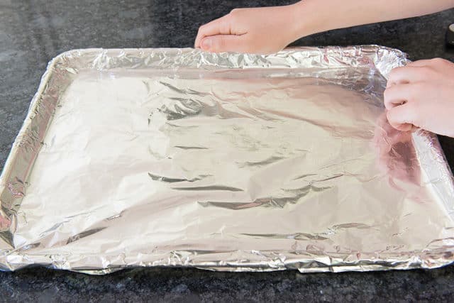 Lining Sheet pan with Aluminum Foil for Cooking Bacon in the Oven