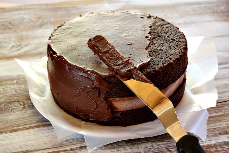 frosting a Chocolate Cheesecake Cake