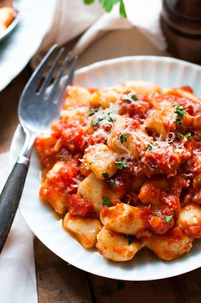 Closeup of ricotta gnocchi with tomato sauce
