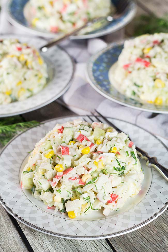 Check out this Russian version of the Imitation Crab Salad. Featuring corn, rice, eggs, and cucumber, it
